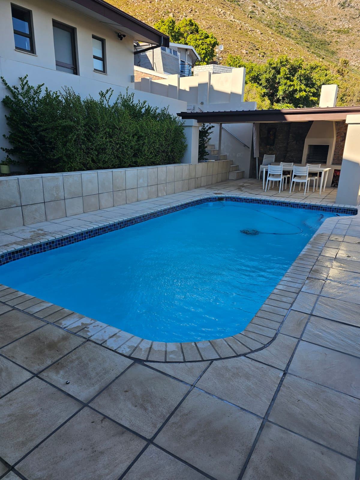 Sparkling pool with a mountain backdrop in Gordon's Bay